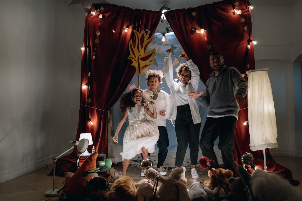 A family performs a fun play with kids in a domestic theater setup.